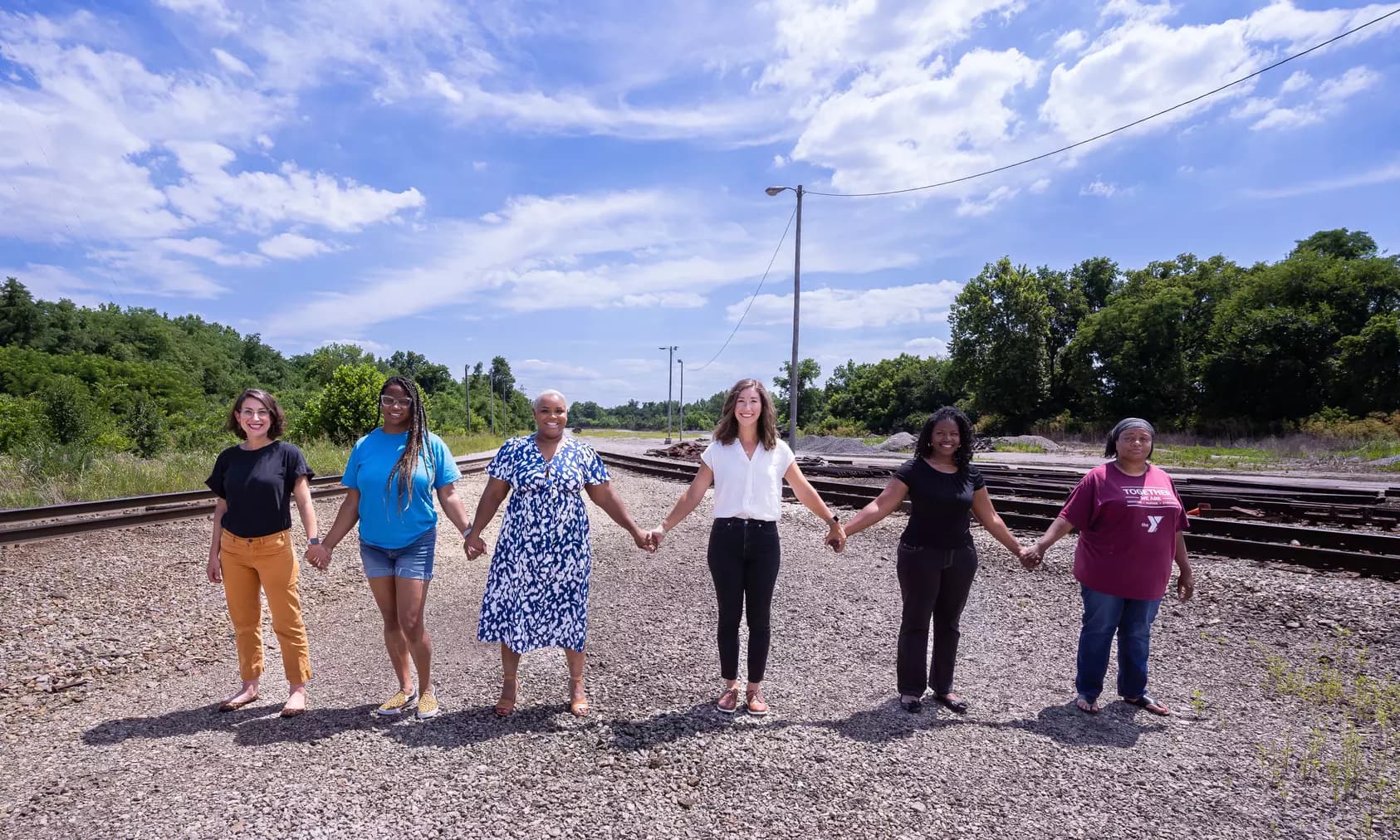 Air Justice members holding hands